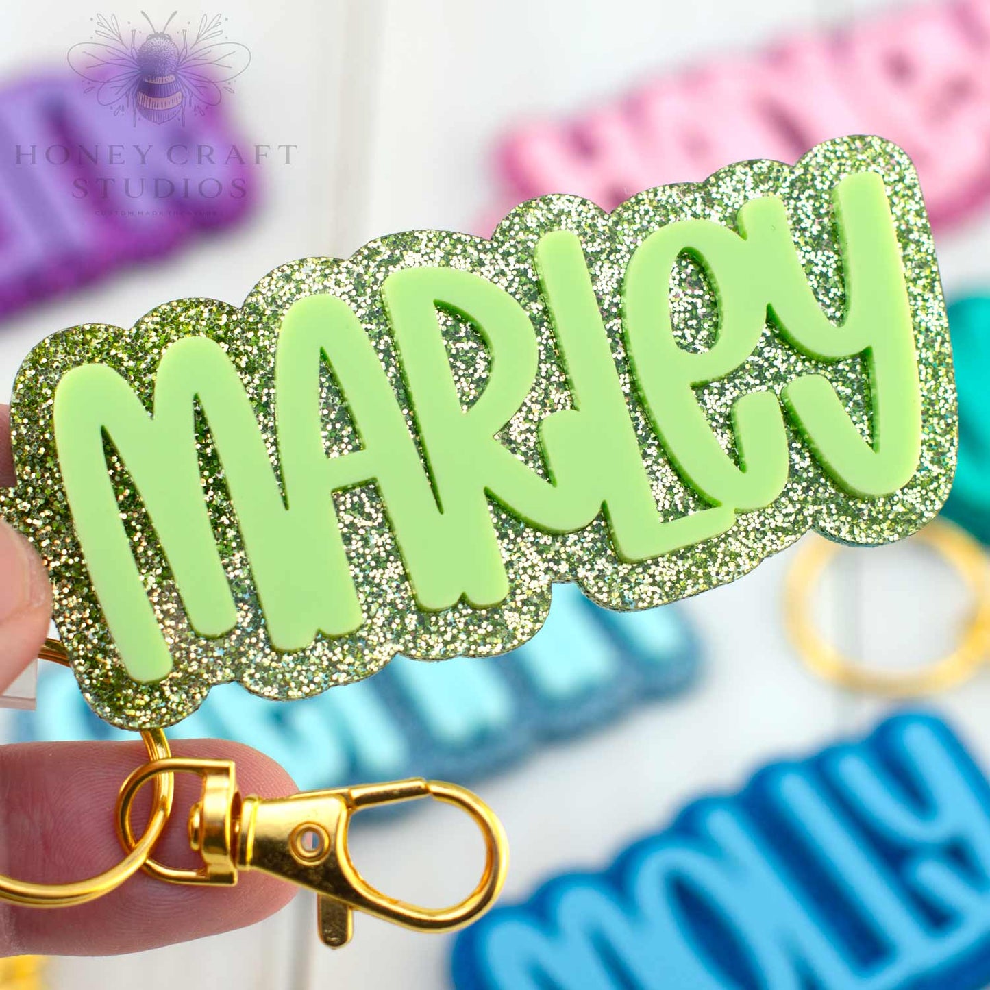 Bright lime green glitter keychain with personalized name, fun and durable backpack tag for kids.