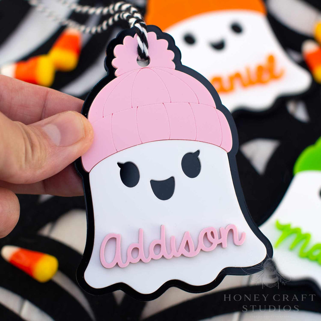 Ghost with Beanie Personalized Name Tag in pink — custom acrylic boo bag tag or backpack keychain for Halloween gifts.