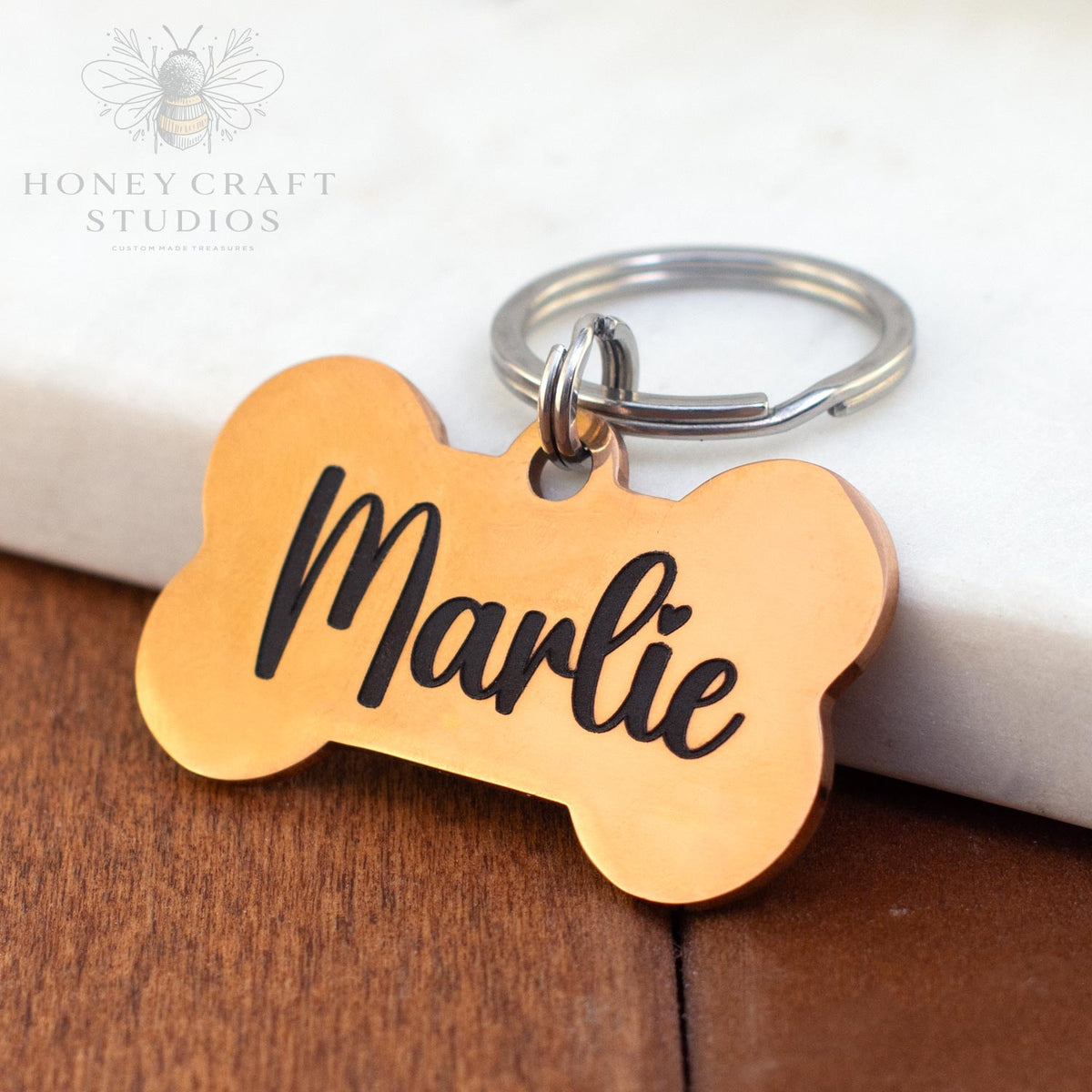 Copper custom dog tag with name Marlie in script font and metal key ring