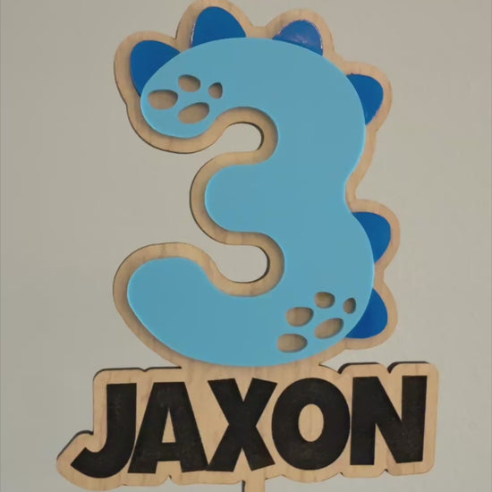 Dinosaur number and name cake topper made from wood and acrylic for a personalized kids dinosaur birthday cake. Made by Honey Craft Studios.